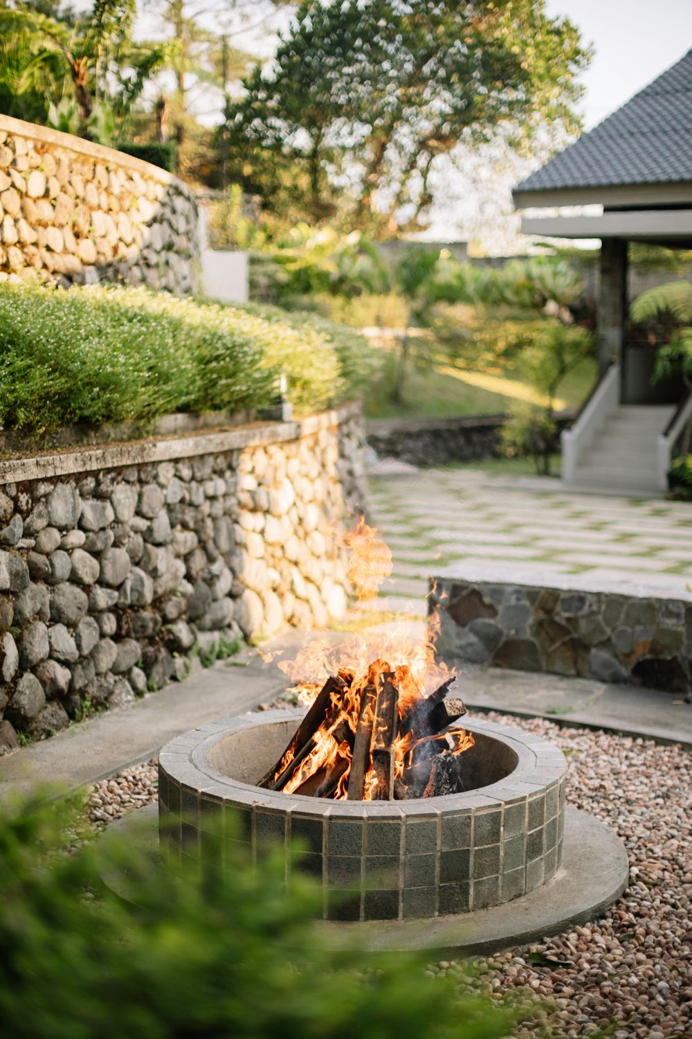 Terraced stone retaining walls with a fire pit